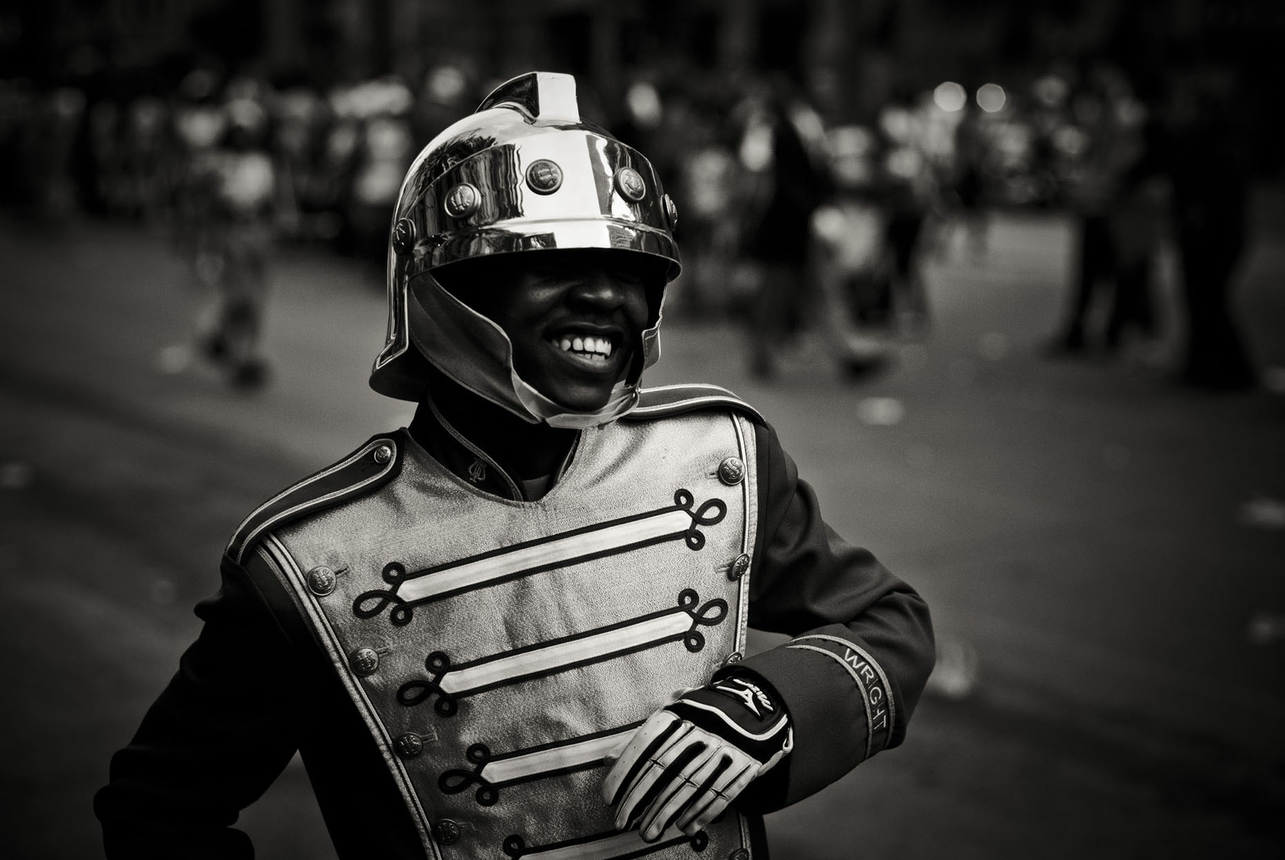 Street portrait of a marching band member in a shining helmet
